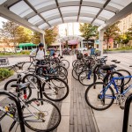 Employee locking bike at metro station